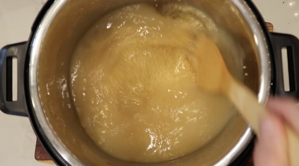 Stirring broth with pastina